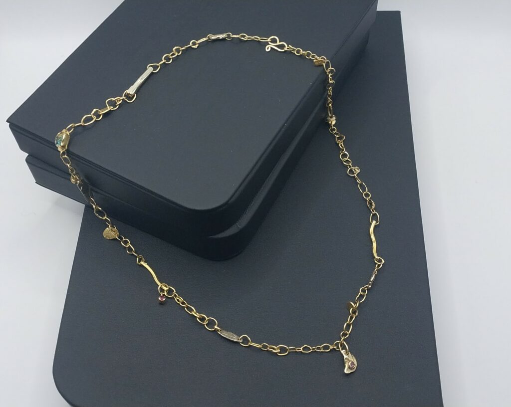 handmade necklace chain in 18k gold with individually unique links