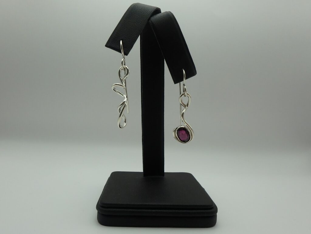 Sterling silver earrings with forged curved wire design set with rhodolite garnet gemstone