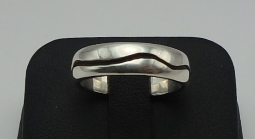 Domed wedding band in sterling silver with recessed natural wave design